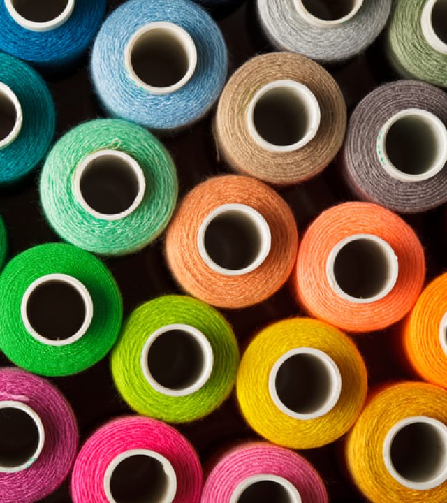 Sewing background Sewing threads multicolored background closeup